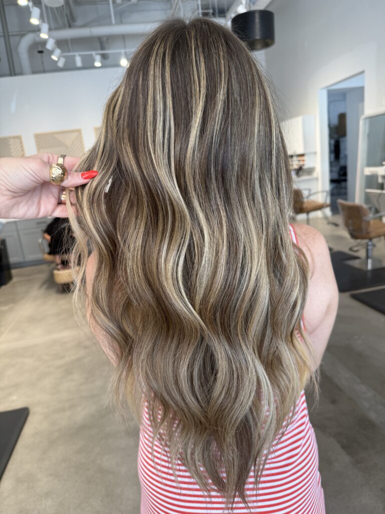 Blonde balayage hairstyle with soft waves